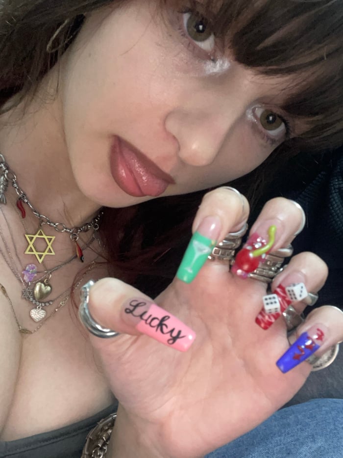Young woman takes selfies at home in Ra'anana