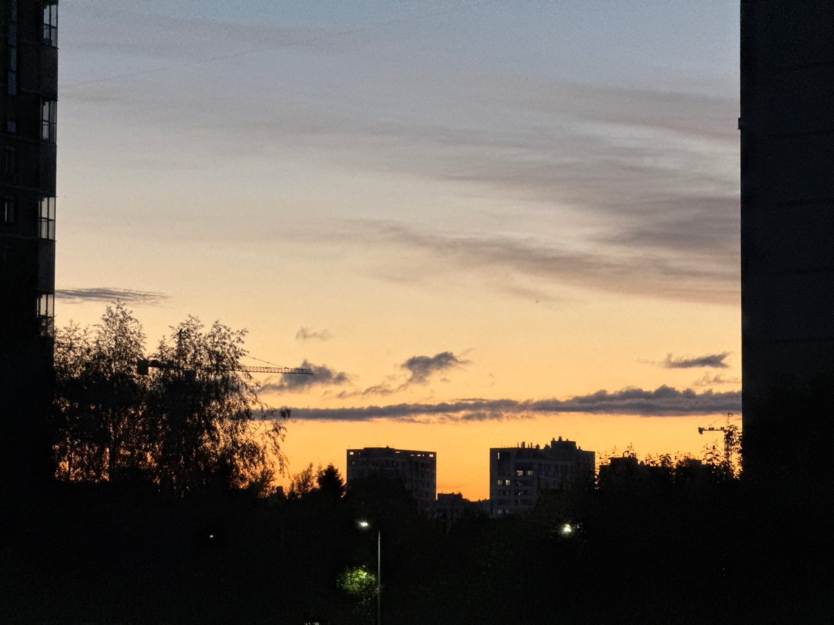 Summer sunset fades over Izhevsk's skyline and apartment blocks