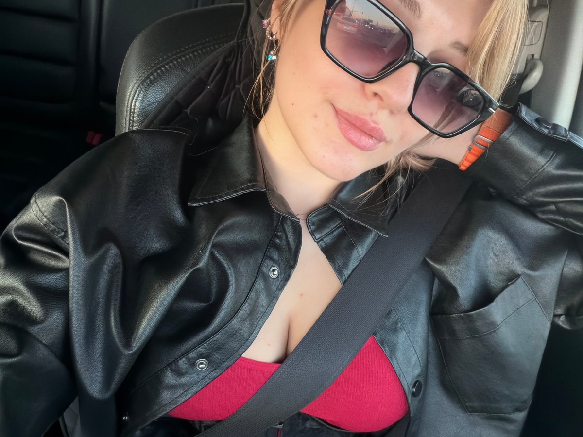 Woman in sunglasses observed traveling by vehicle in Naberezhnye Chelny