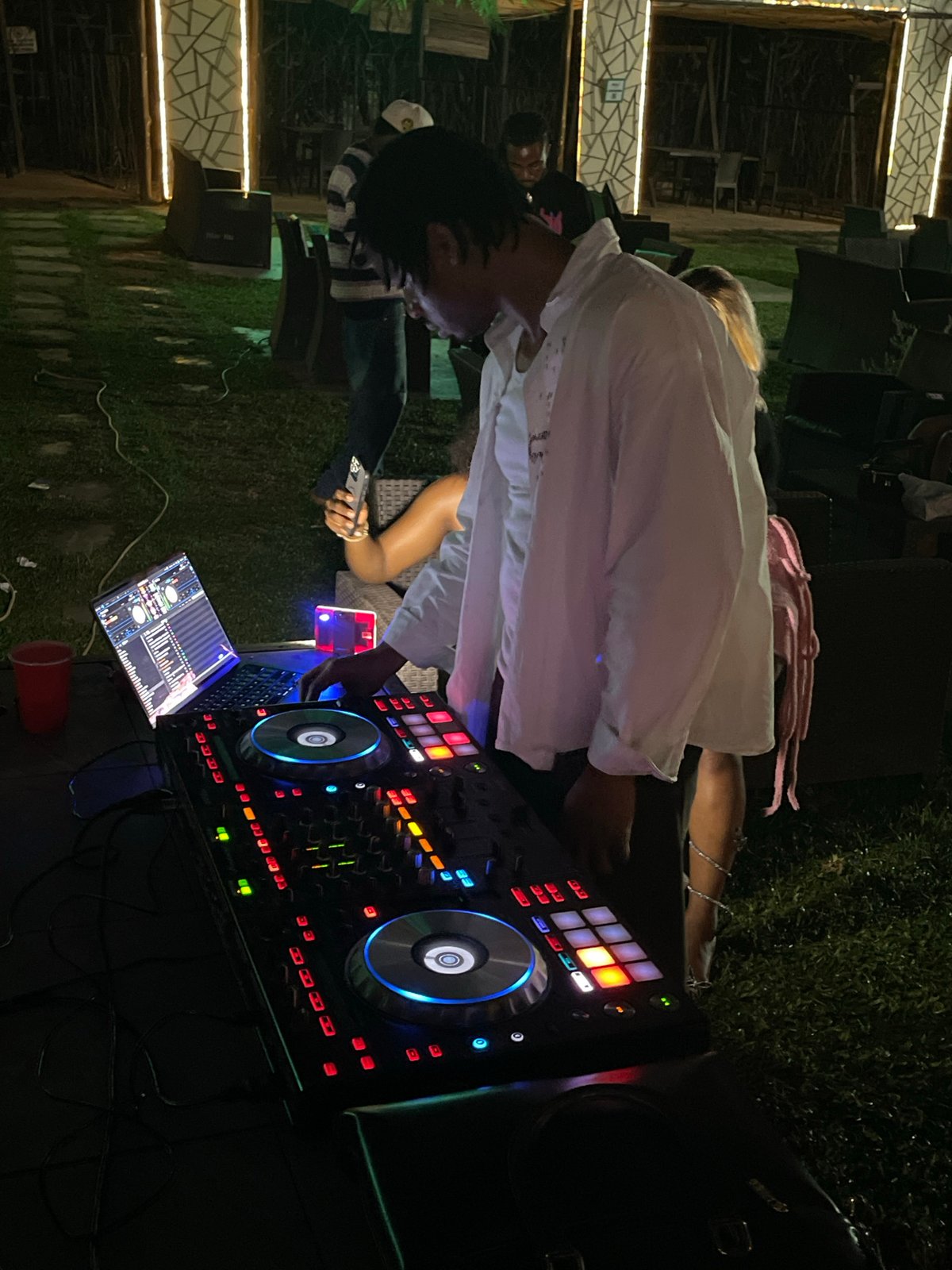 Late-night outdoor party in Abuja with DJ and dancing