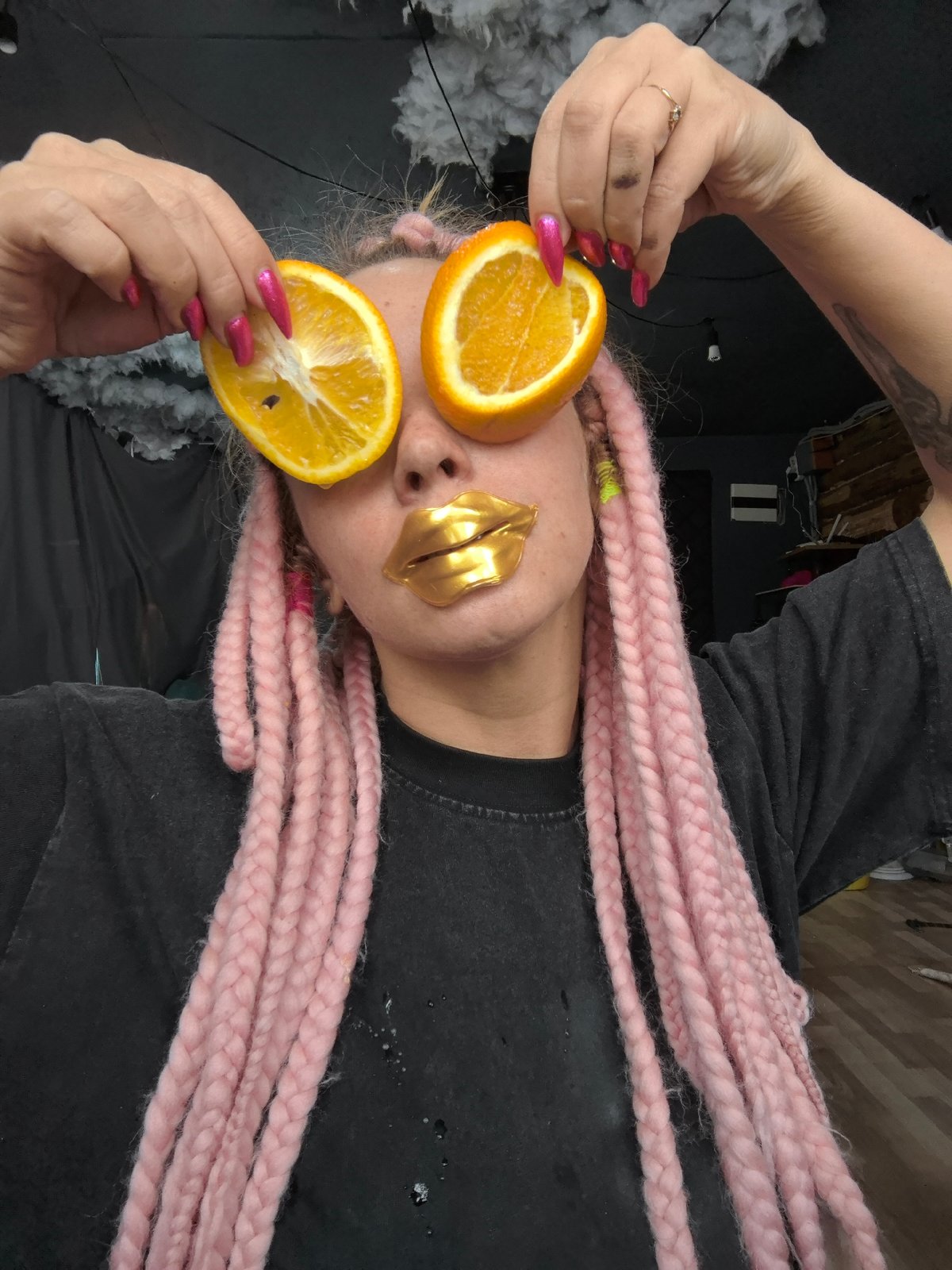 Person with pink dreadlocks plays in snow in Russia