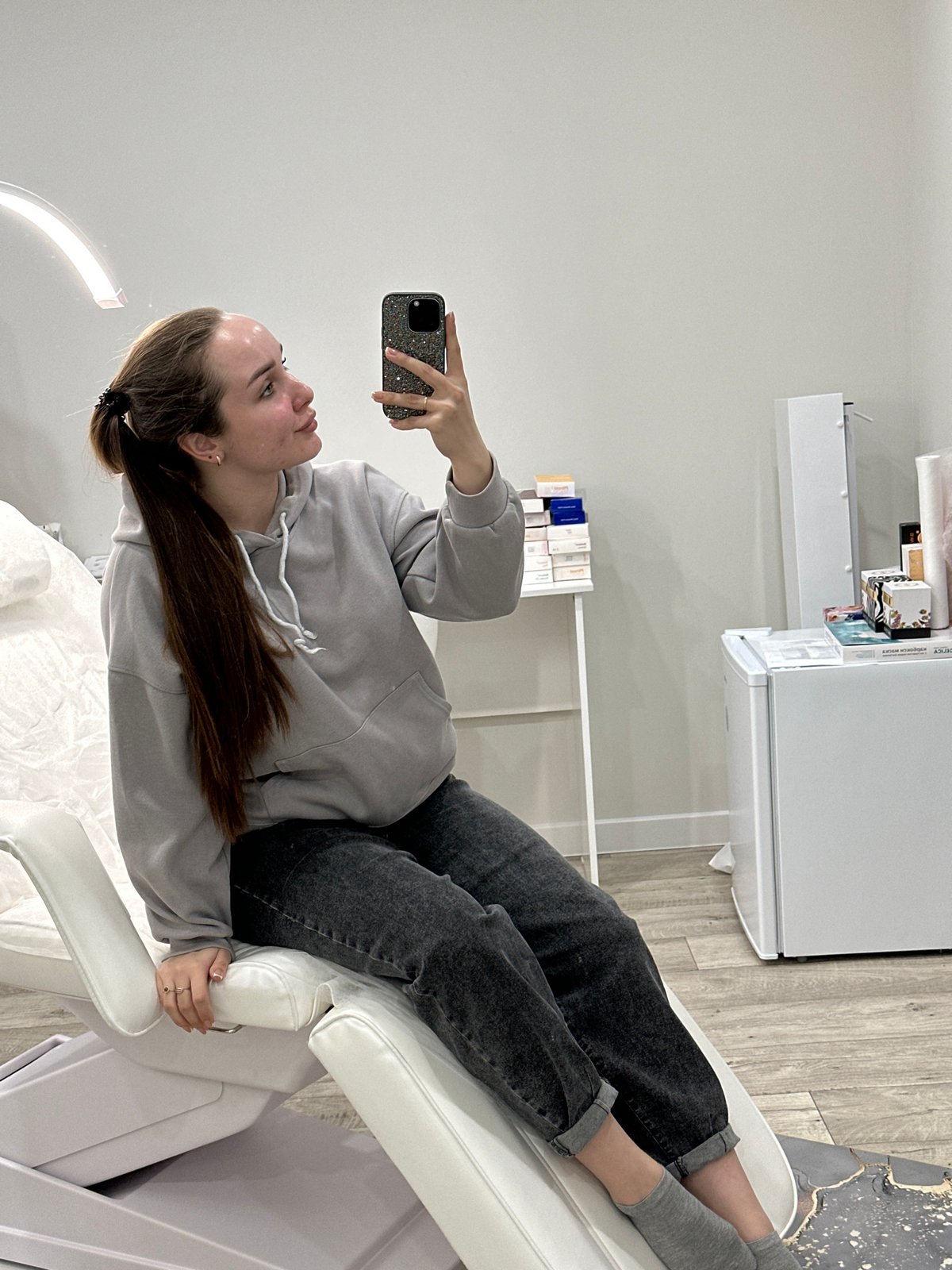 Woman receives facial treatment at medical facility in Russia