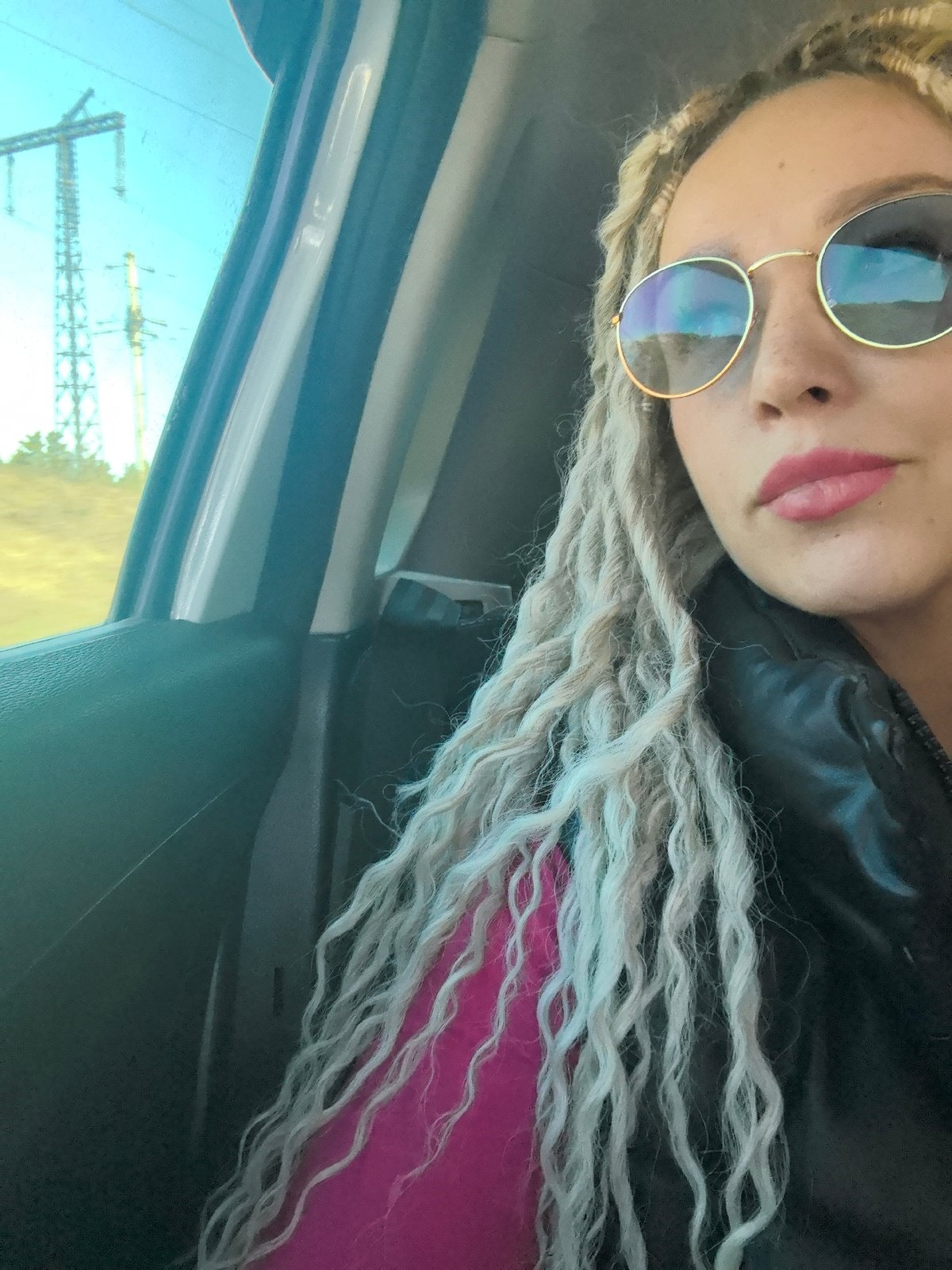 Person with dreadlocks photographed in car in Chaikovsky, Russia