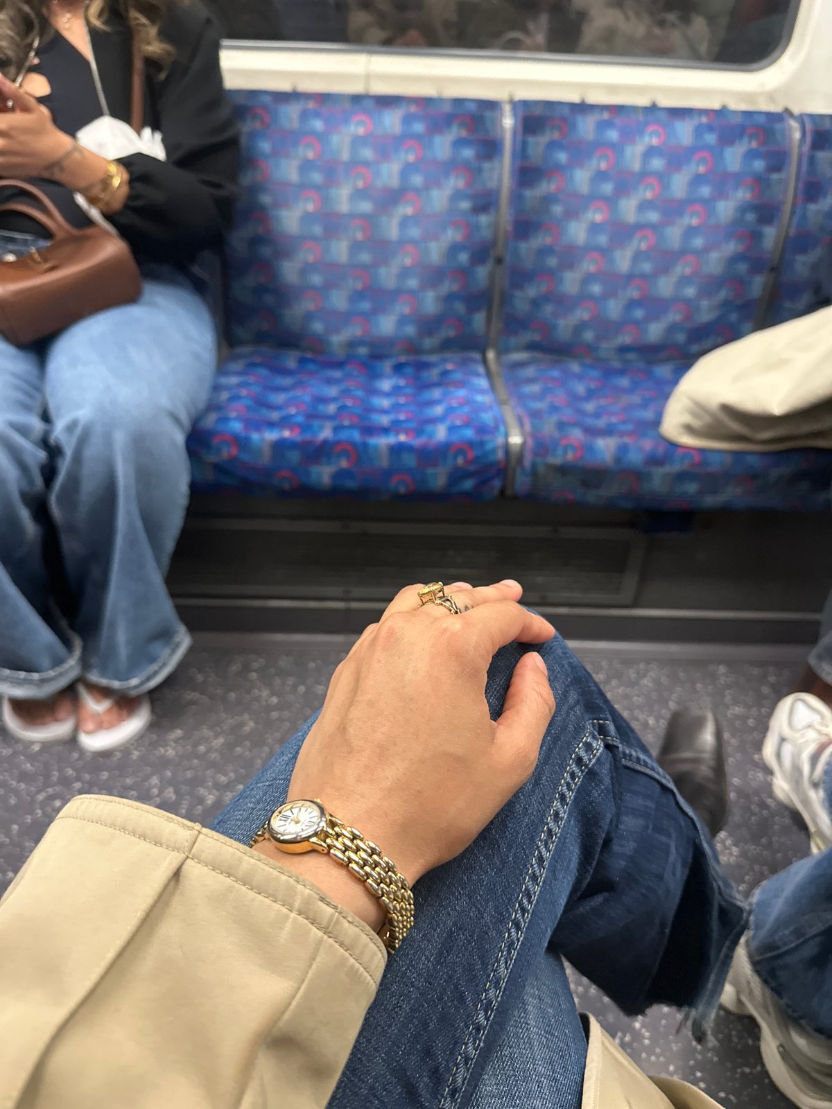 Commuter travels London Underground during evening rush hour