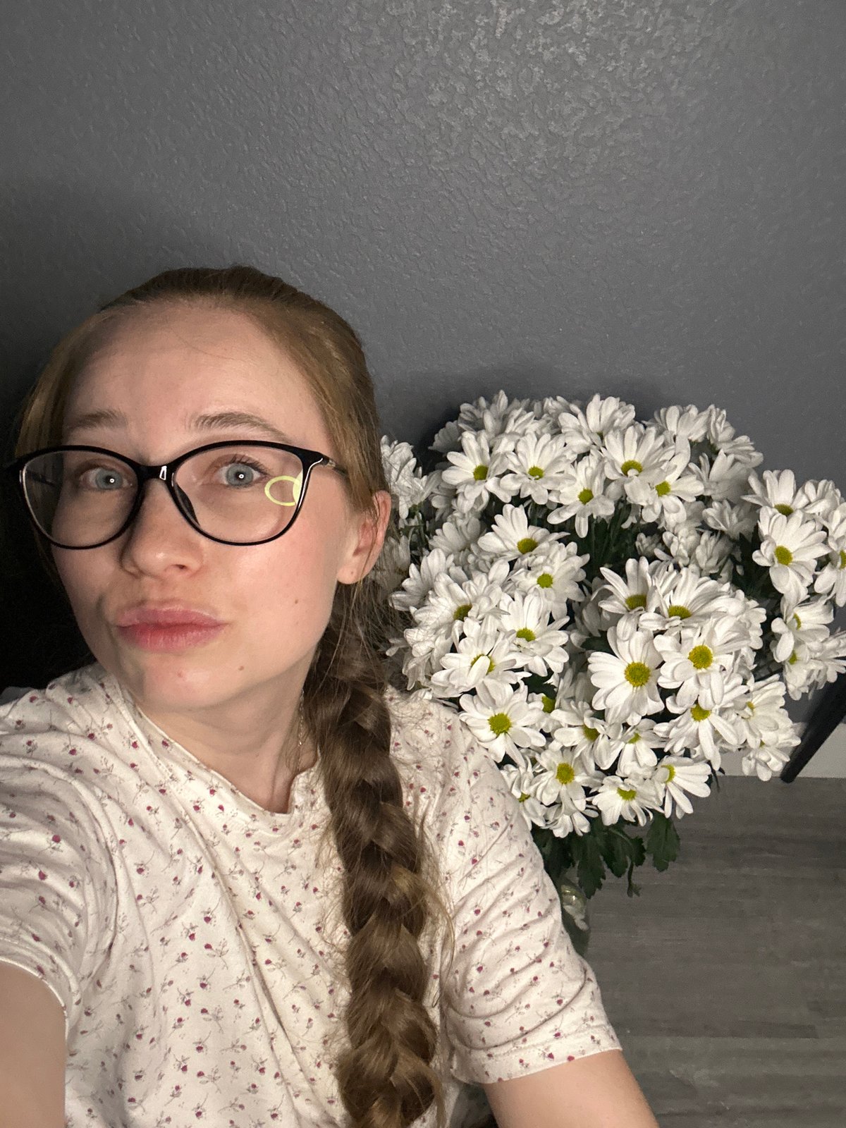 Woman documents evening with flowers and beer in Saint Petersburg