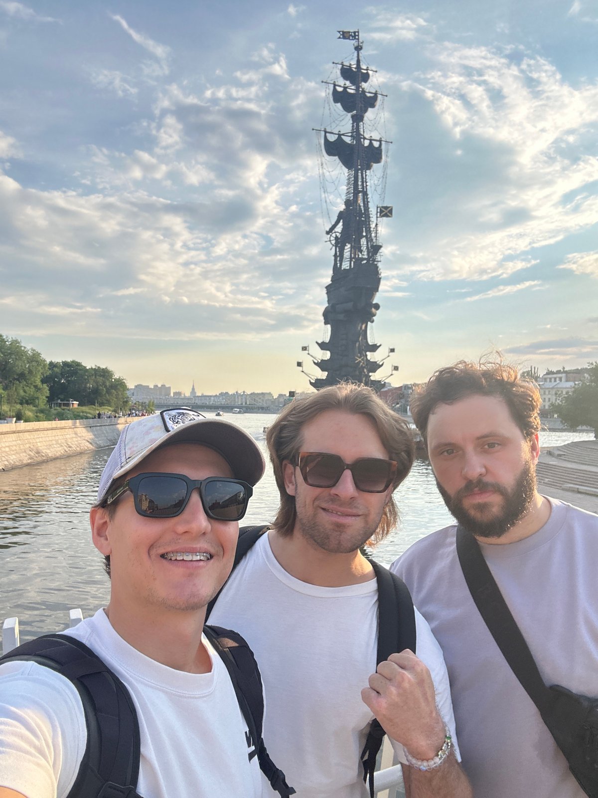 Tourist documents Moscow landmarks during afternoon river tour