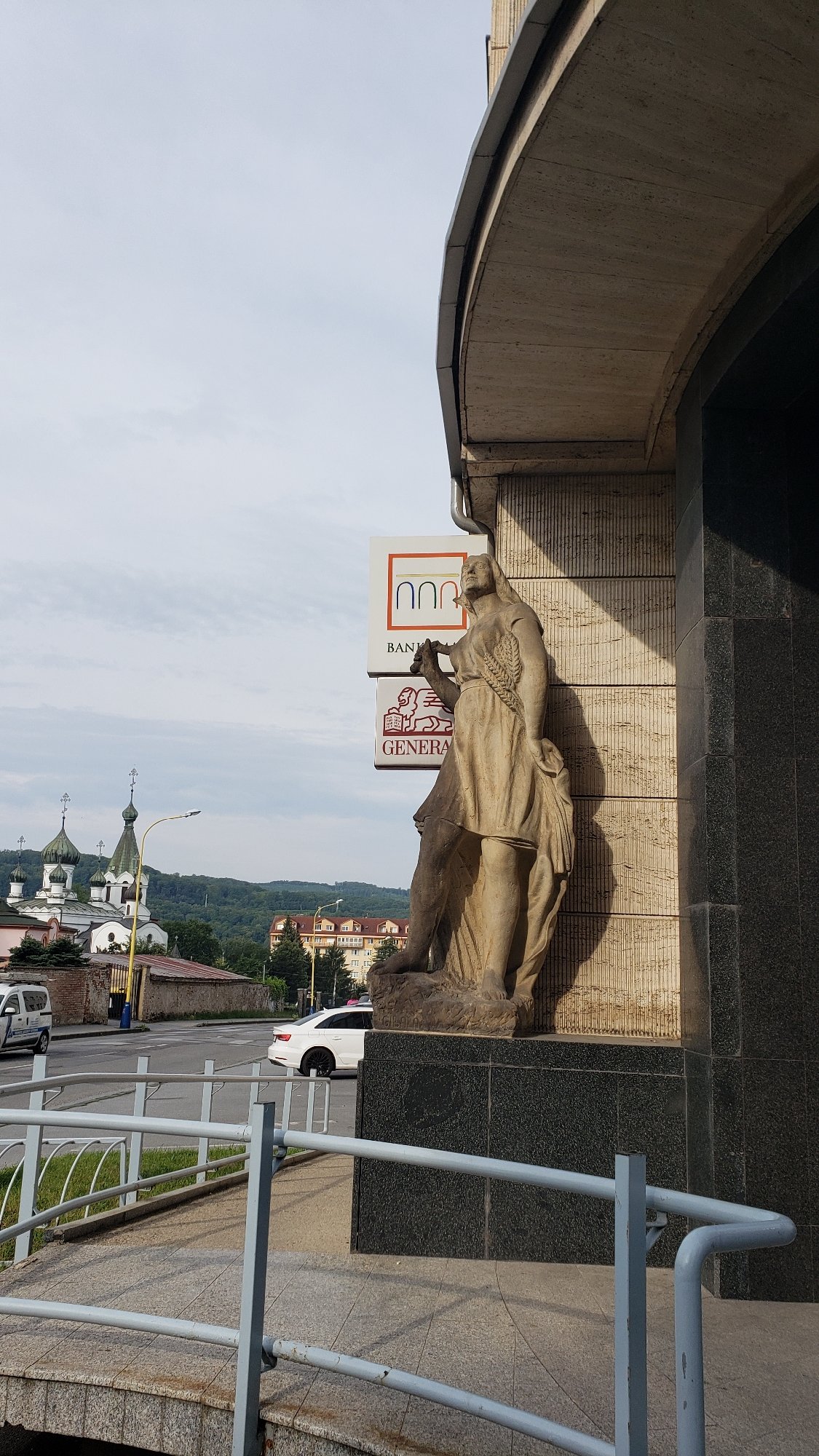 Street-level snapshot of Prešov's churches, buildings, and city life