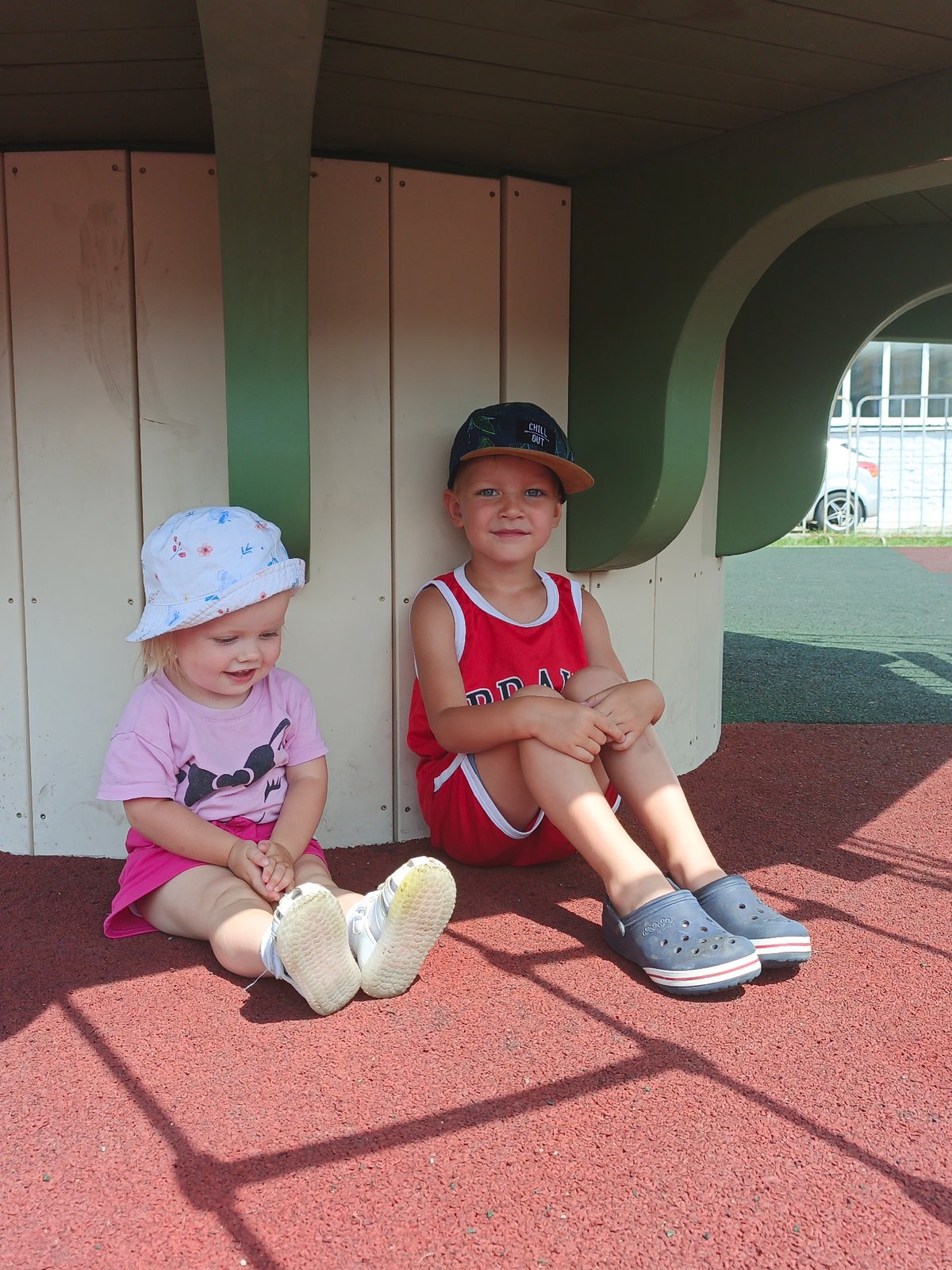 Summer morning at a Zlatoust playground, kids and adults relaxing