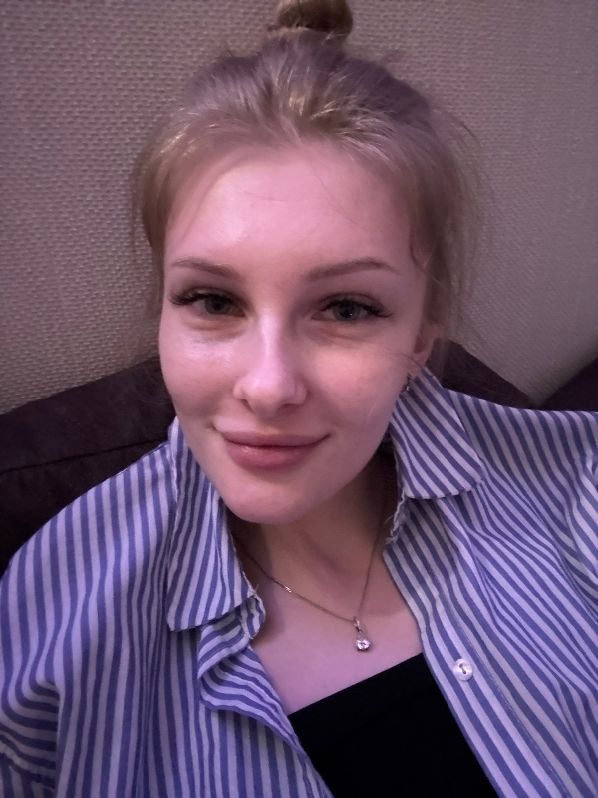 Woman poses playfully for photos in Perm home