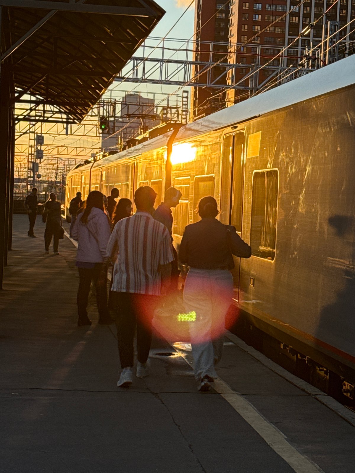 Moscow train station at sunset, platforms and tracks in golden light