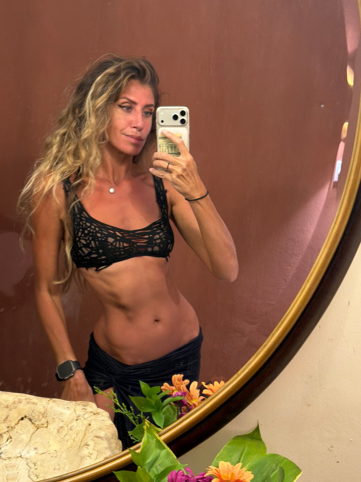 Mirror selfies in a moody, ornate room in Ubud