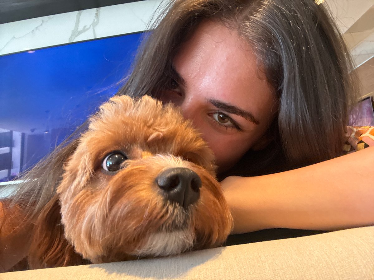 Woman takes selfies with small dog in Boca Raton