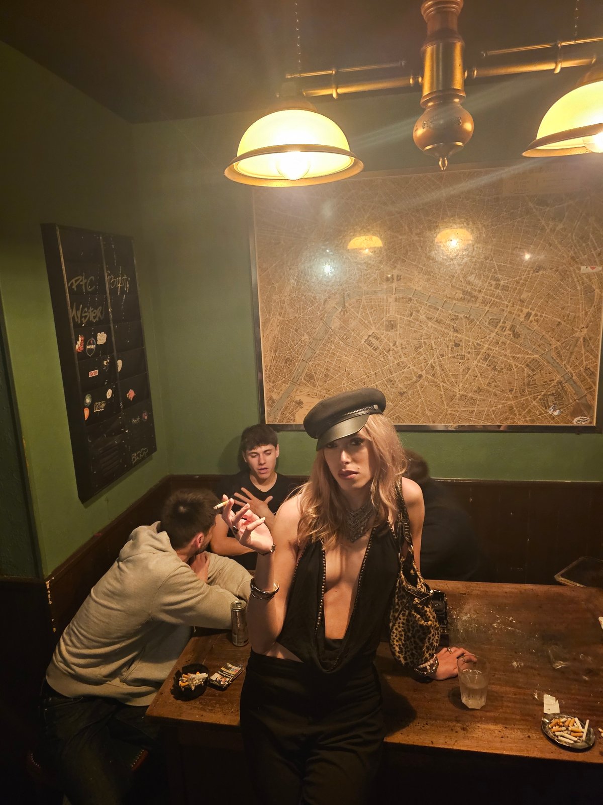 Late night social gathering captured at Paris bar