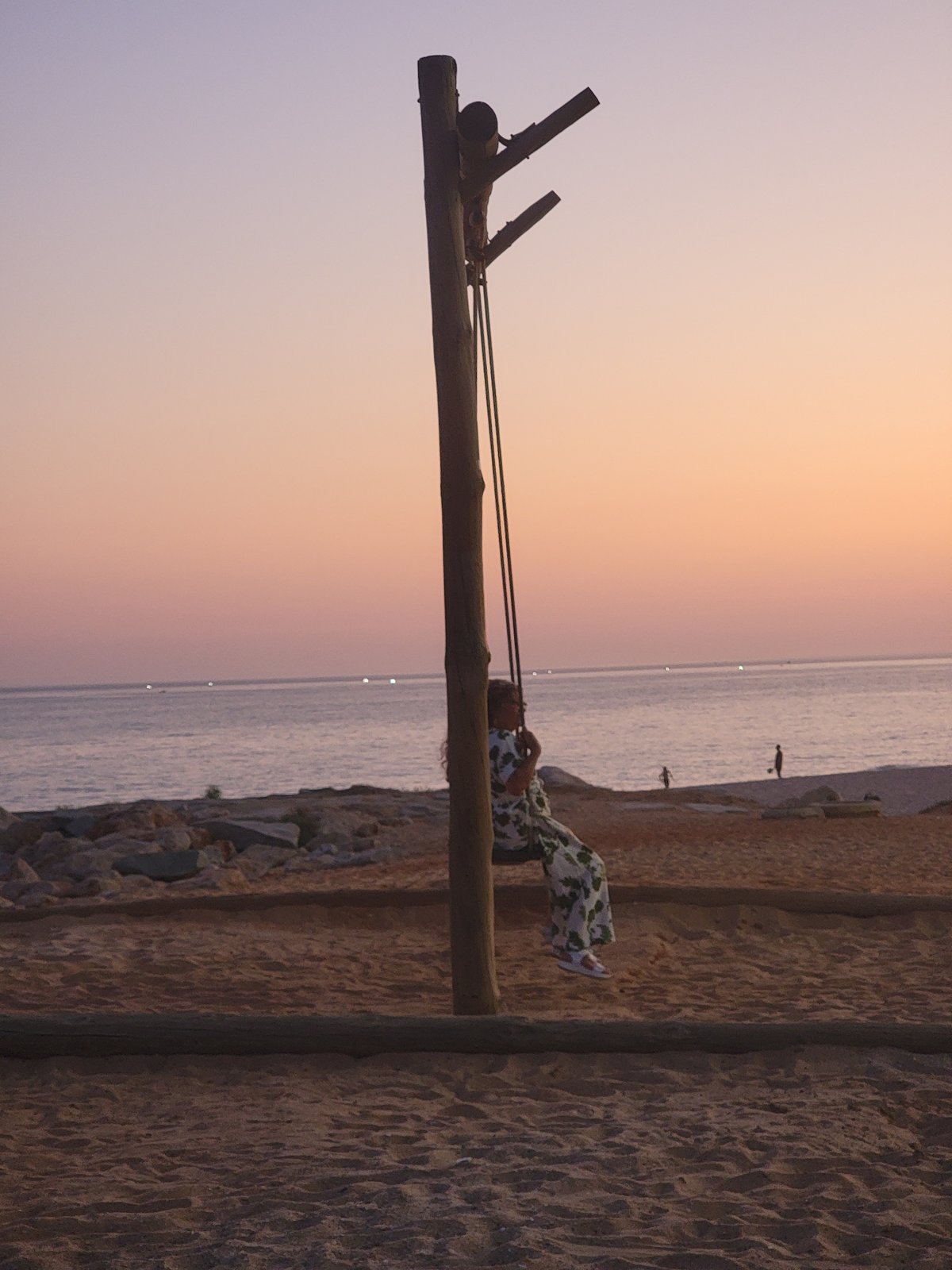 Quarteira coastline at golden hour, beach life winding down
