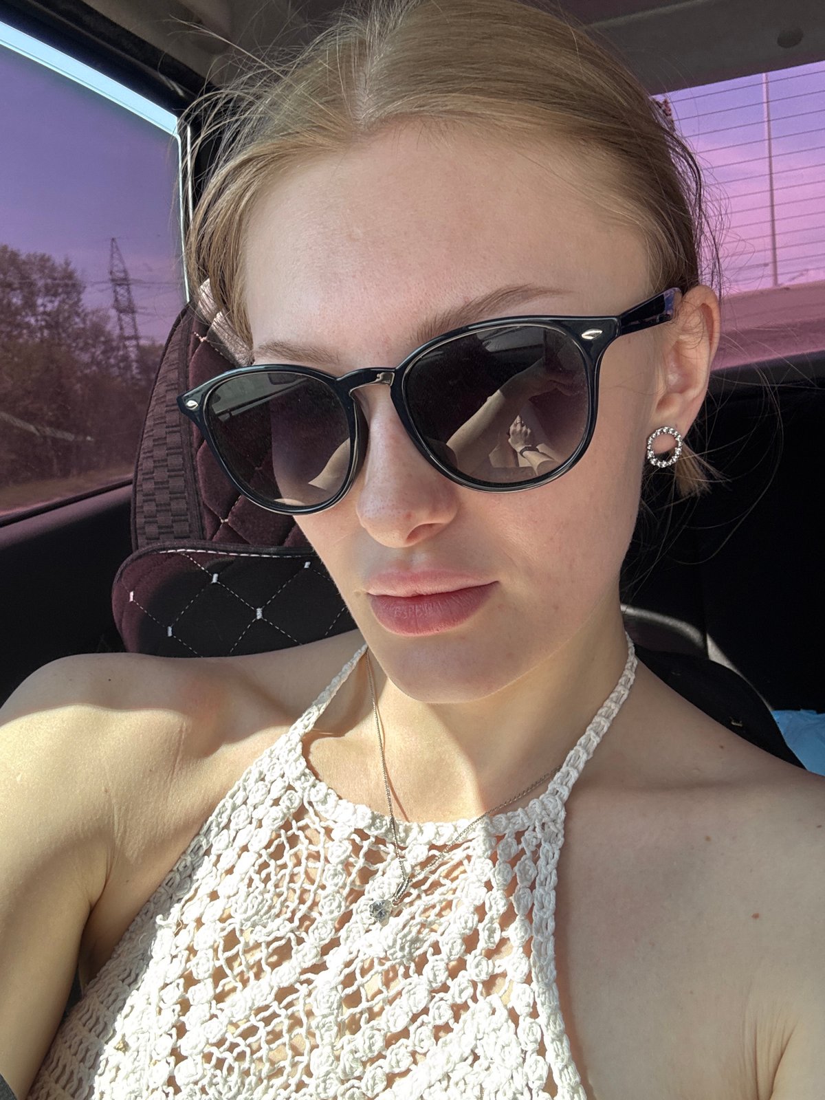 Person in sunglasses, white top spotted in car, Perm