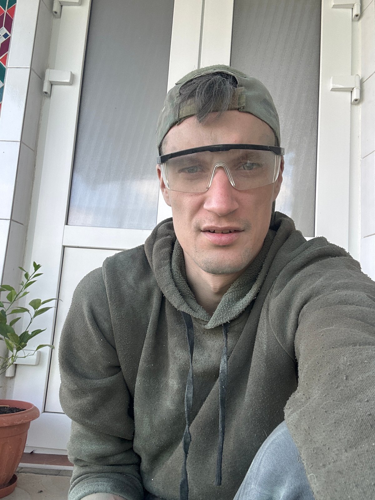 Selfie series with a dog, safety gear on, Makiv, Ukraine