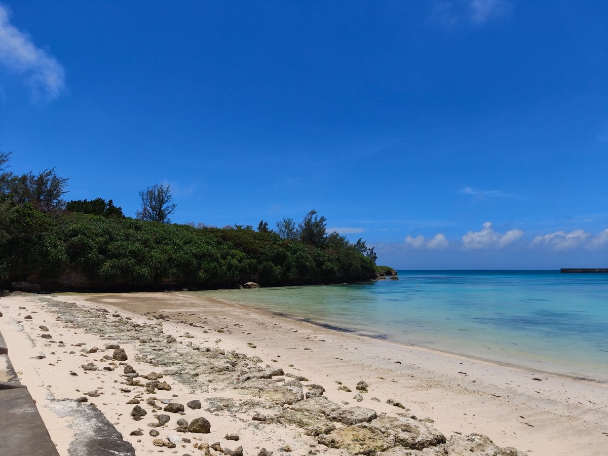 Calm turquoise shoreline on a clear day in Miyakojima