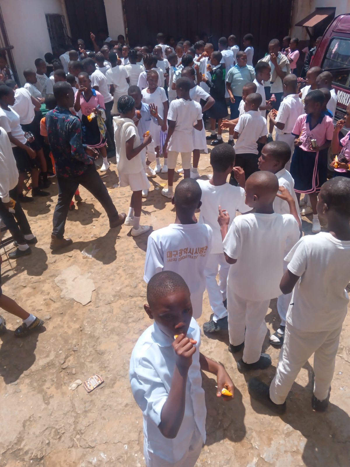 Students gather across a school campus in Onitsha, Nigeria