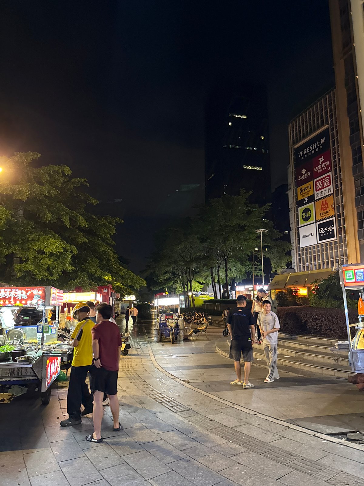 Haizhu District streets buzzing on a rainy June night