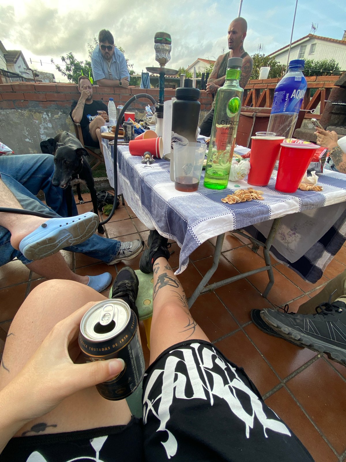 Friends gather for drinks on Gijón rooftop terrace