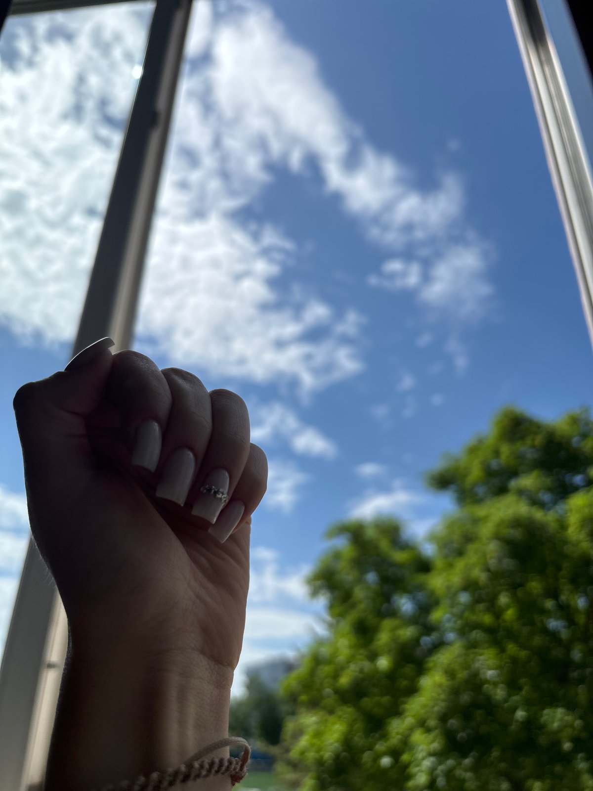 Decorated Hand Clenched Into Fist Captured at Unknown Location
