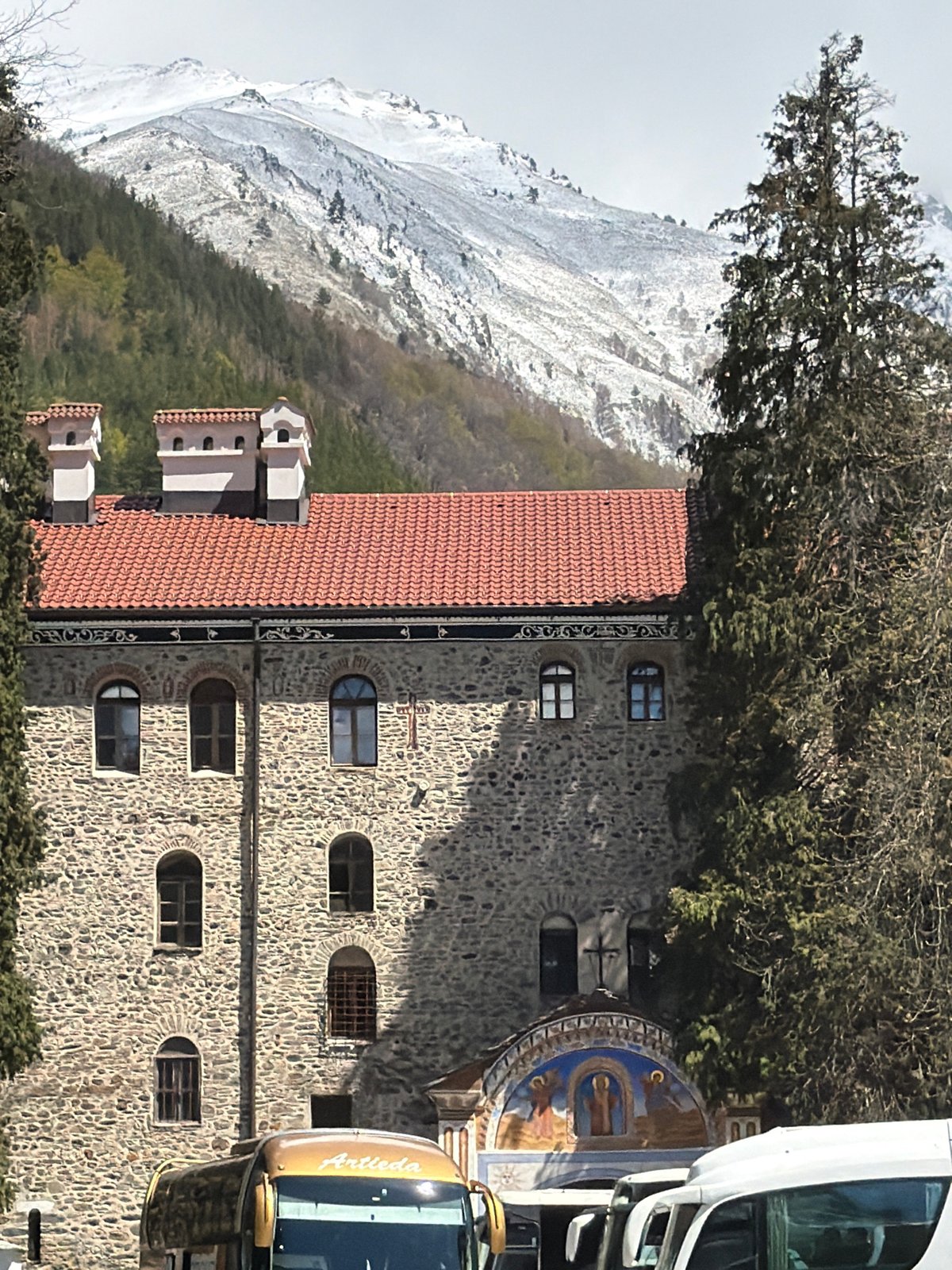 Rila Monastery captured amid snow-covered Bulgarian mountain landscape