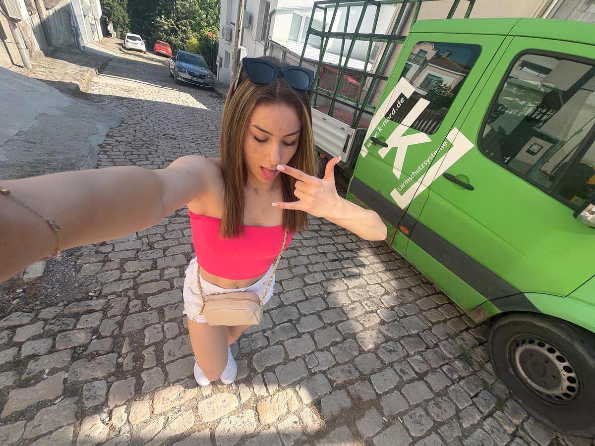 Selfie on a sunny cobblestone street in Shumen, Bulgaria