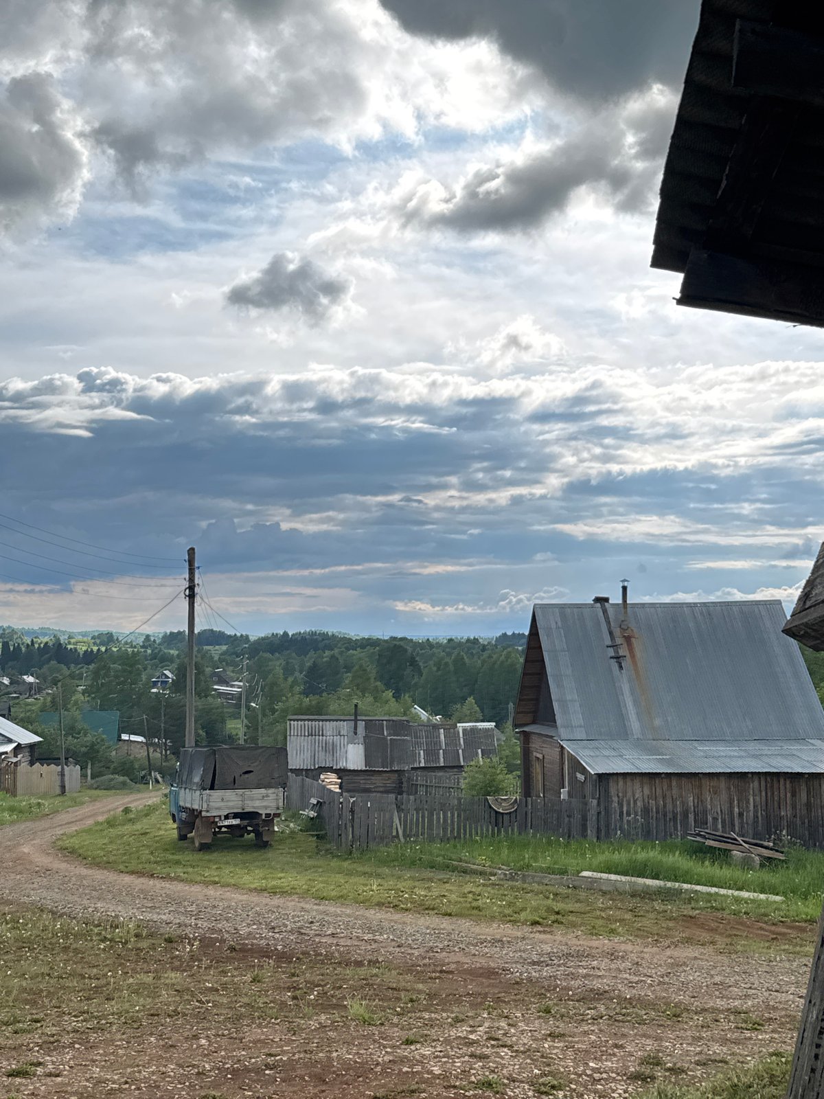 Rural life documented in Russian village under cloudy skies