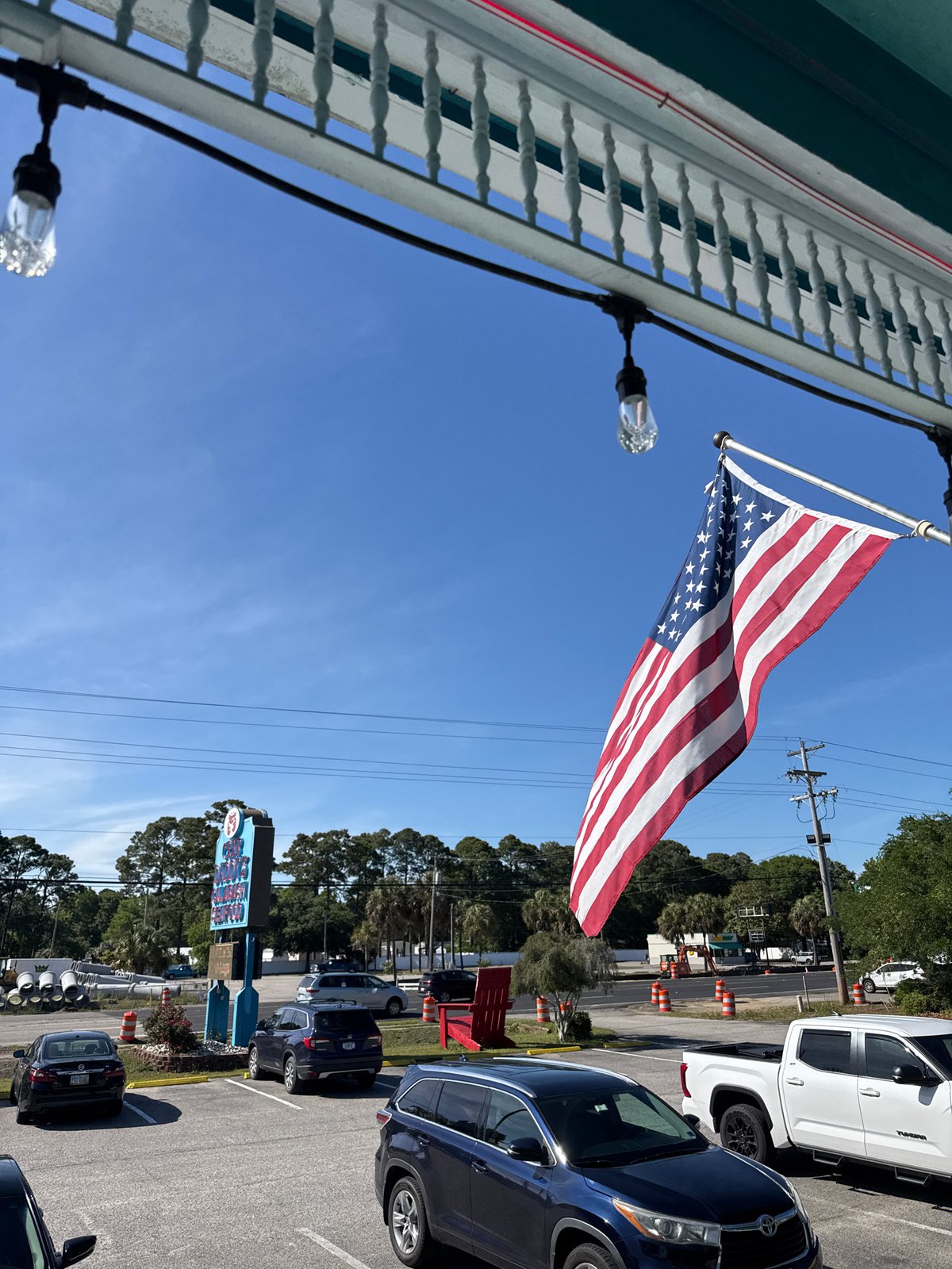 American flag flies on sunny day at Garden City Beach