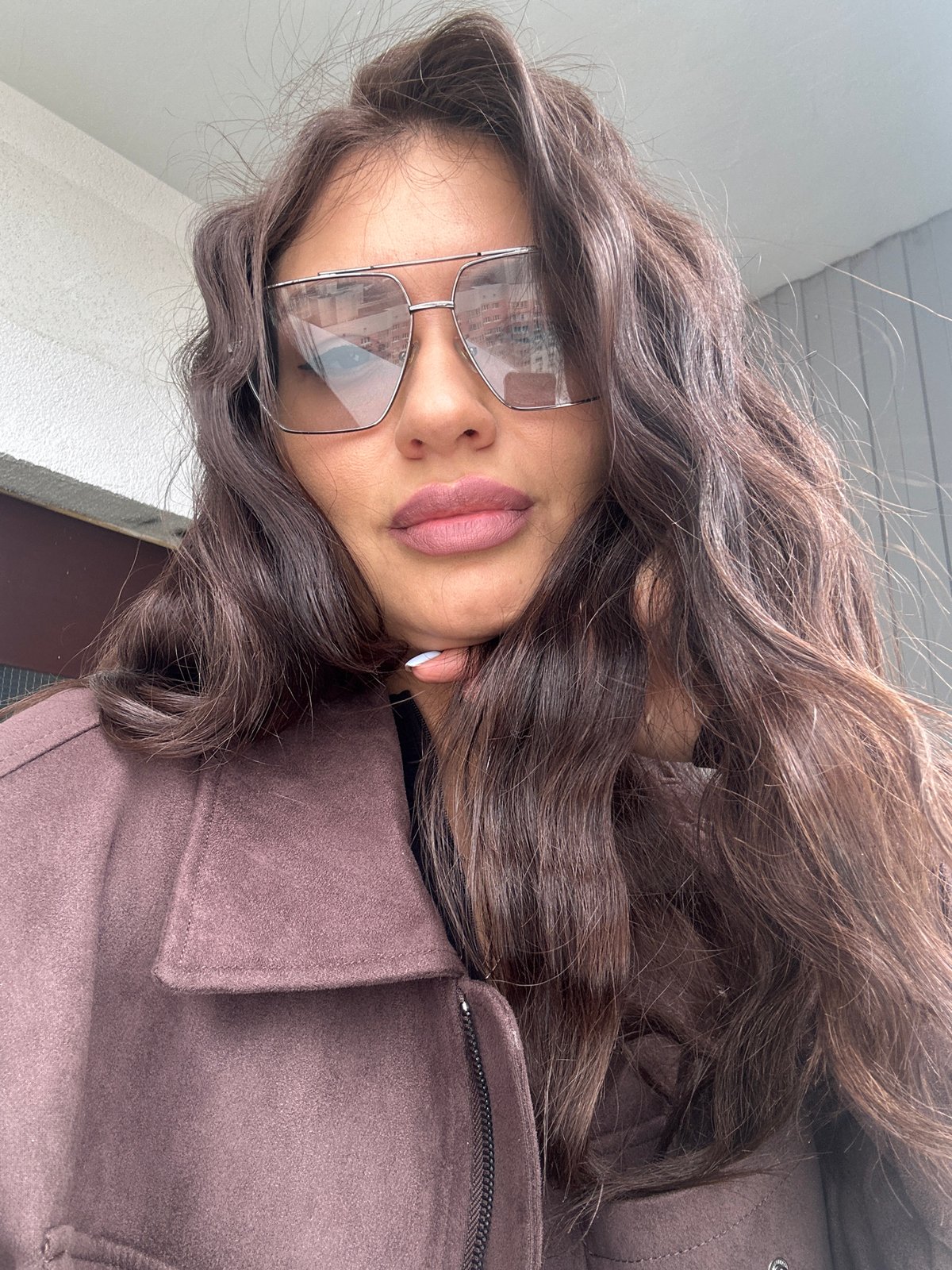 Woman in brown coat spotted in Khimki under overcast sky