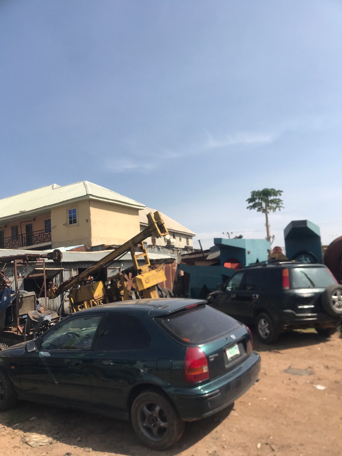 Commercial area with vehicles and crane documented in Rafin Par