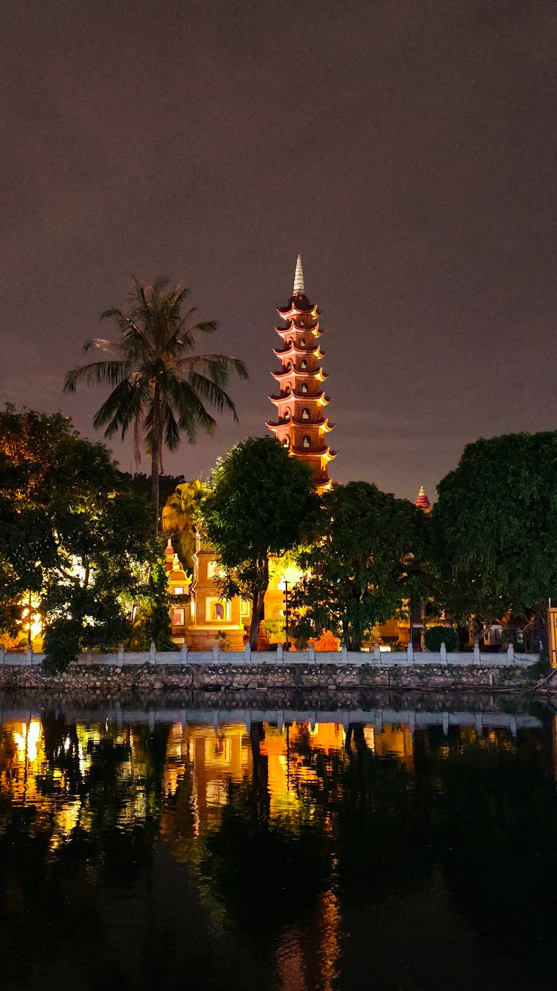 Hanoi at night: lakeside landmarks and a luxury hotel