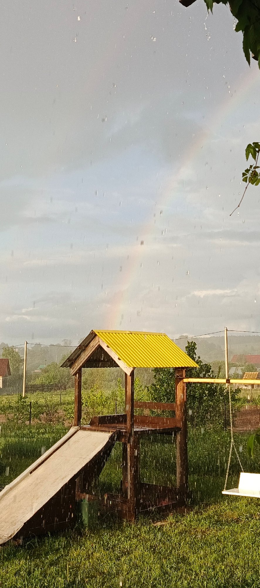 Rainbow appears during heavy rainstorm in Russian village