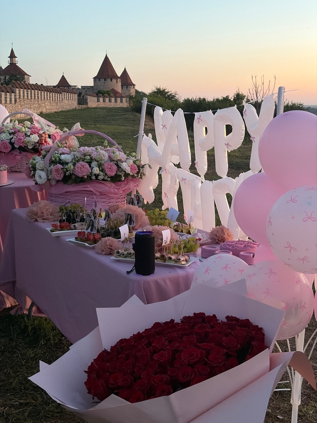 Birthday party setup at Bender Fortress under a Moldova sunset