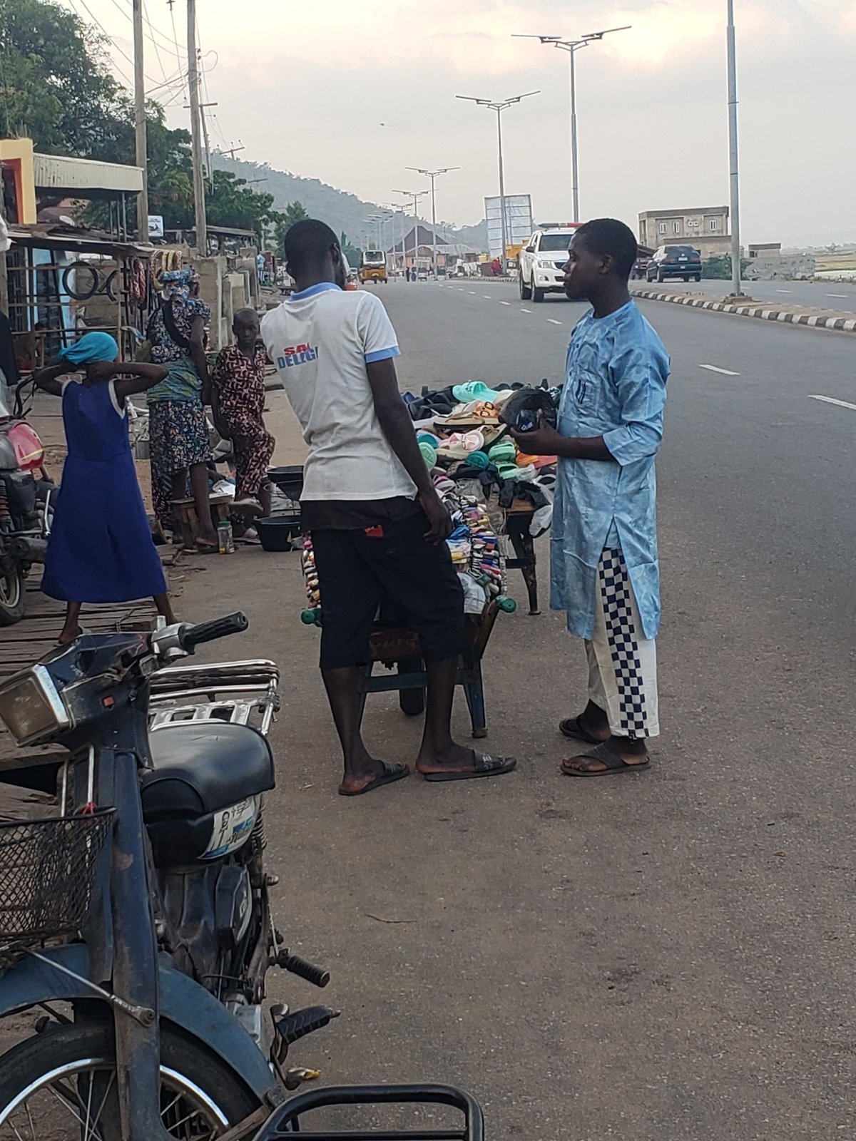 Street vendors conduct business in Lokoja, Nigeria afternoon markets