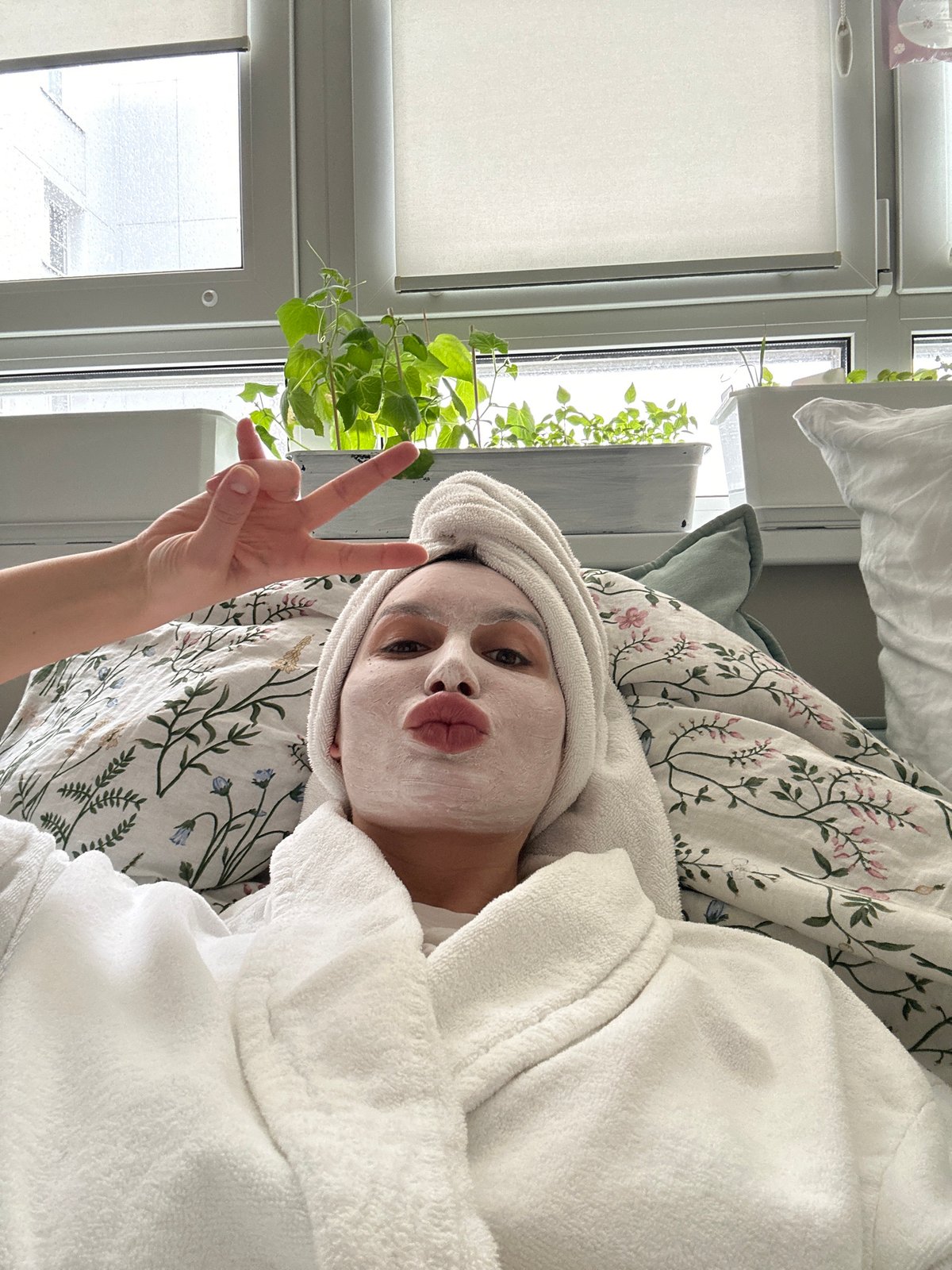 Woman enjoys morning skincare routine with dog companion in Moscow