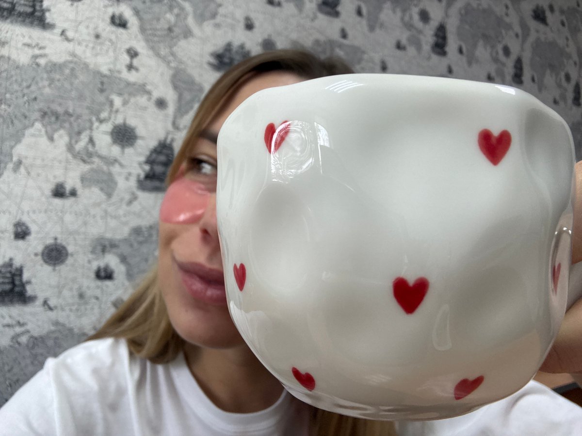 Woman relaxes with skincare routine and hot beverage in Russia