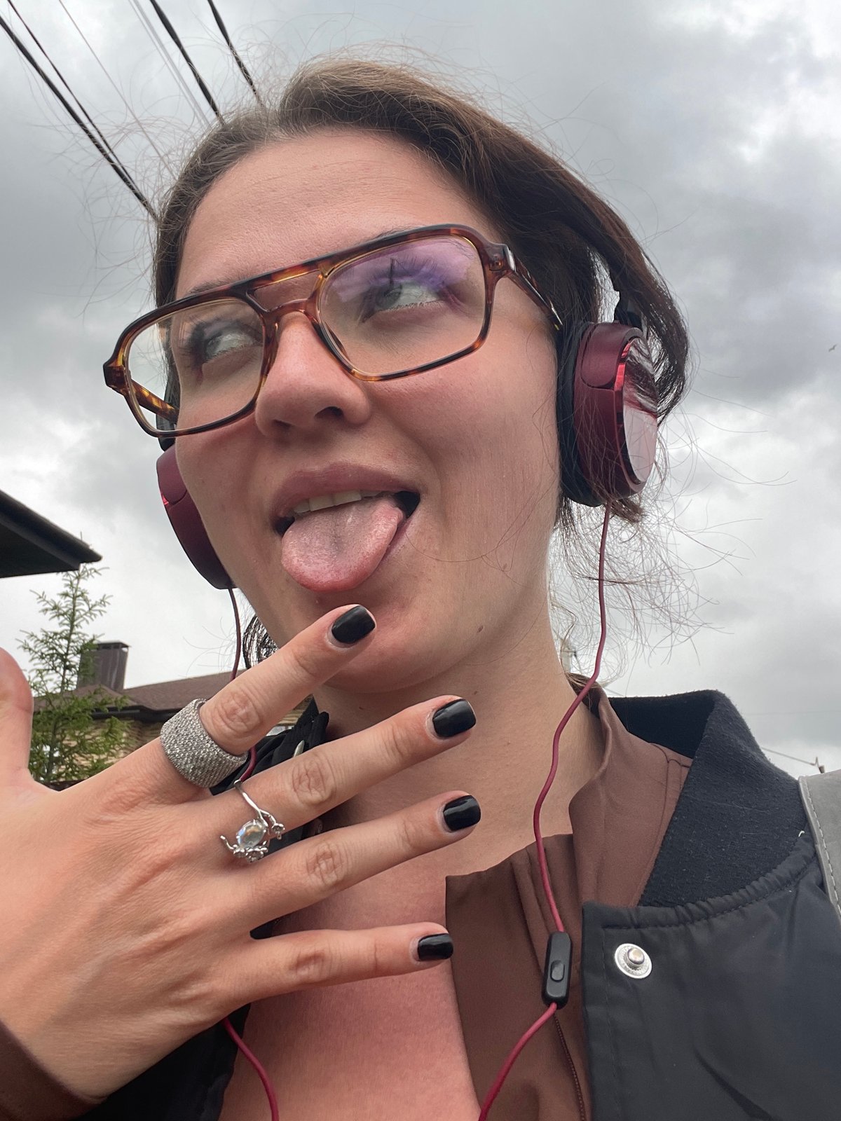 Woman takes playful selfies in Misaylovo, Russia