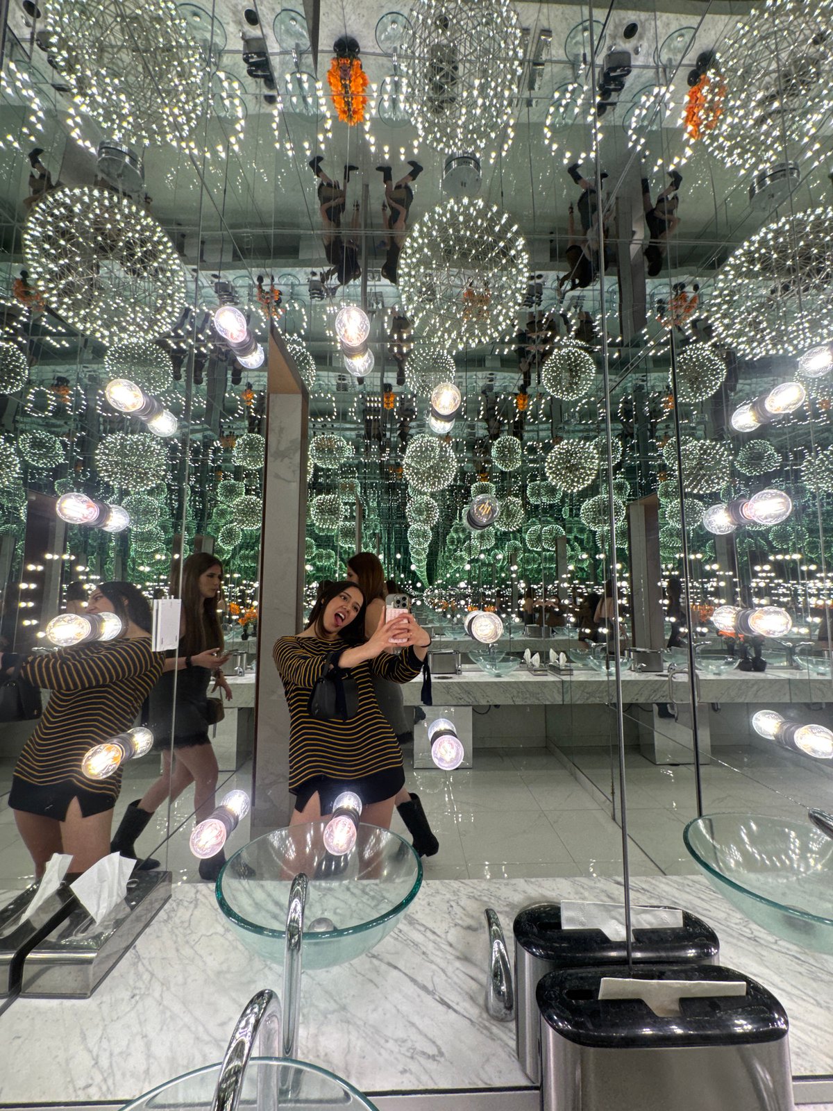 Visitors capture selfies in infinity mirror room in Puebla