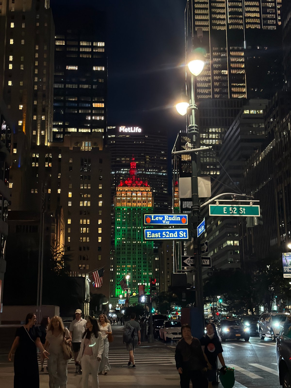 Midtown Manhattan intersection glowing after midnight
