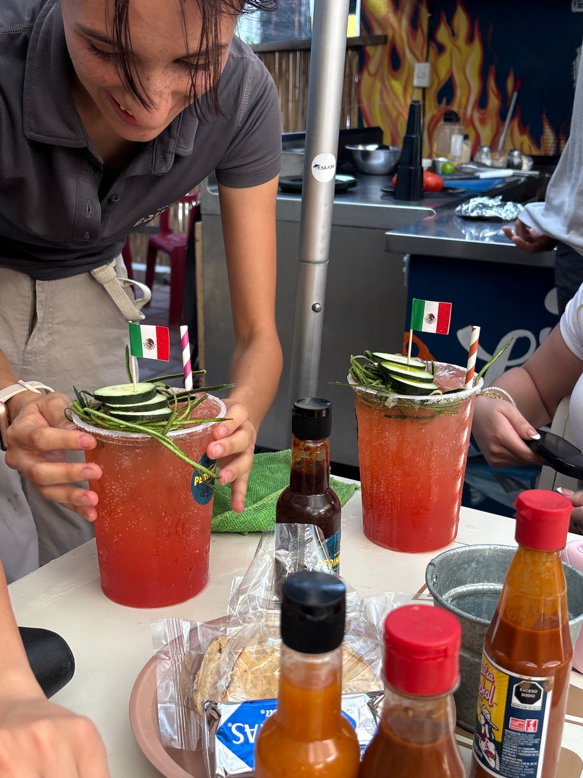 Patio drinks with festive garnishes in San Pedro Garza García