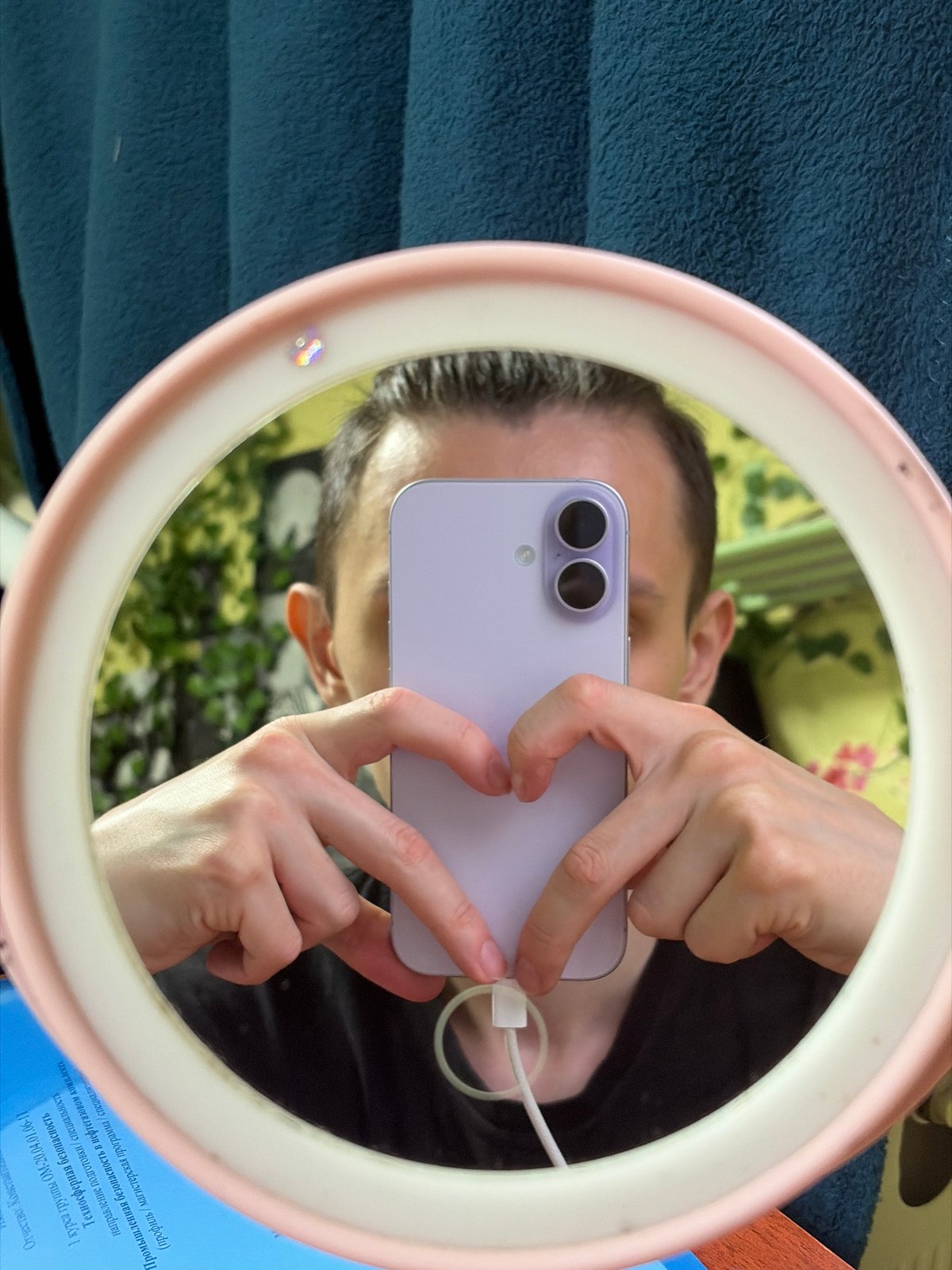 Ring light mirror selfie session with a lavender phone