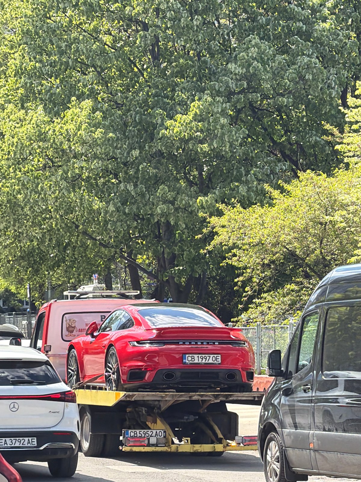 Red Porsche towed on Sofia street