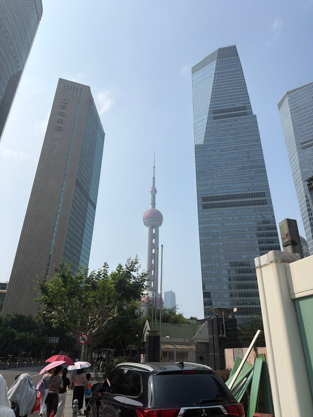 Pudong skyline and streets on a sunny July morning