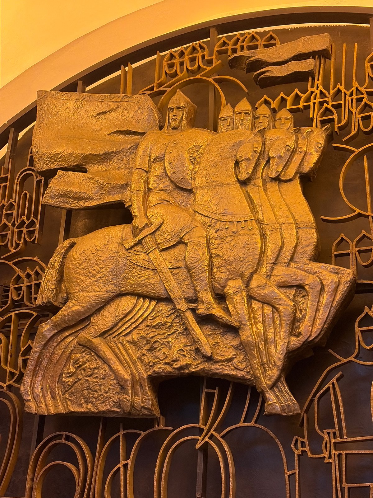 Gold equestrian bas-relief sculpture documented in Saint Petersburg