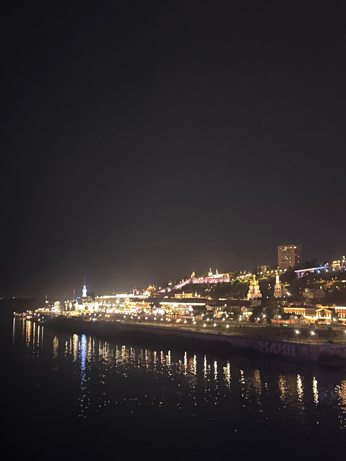 Nizhny Novgorod glows along the waterfront after dark
