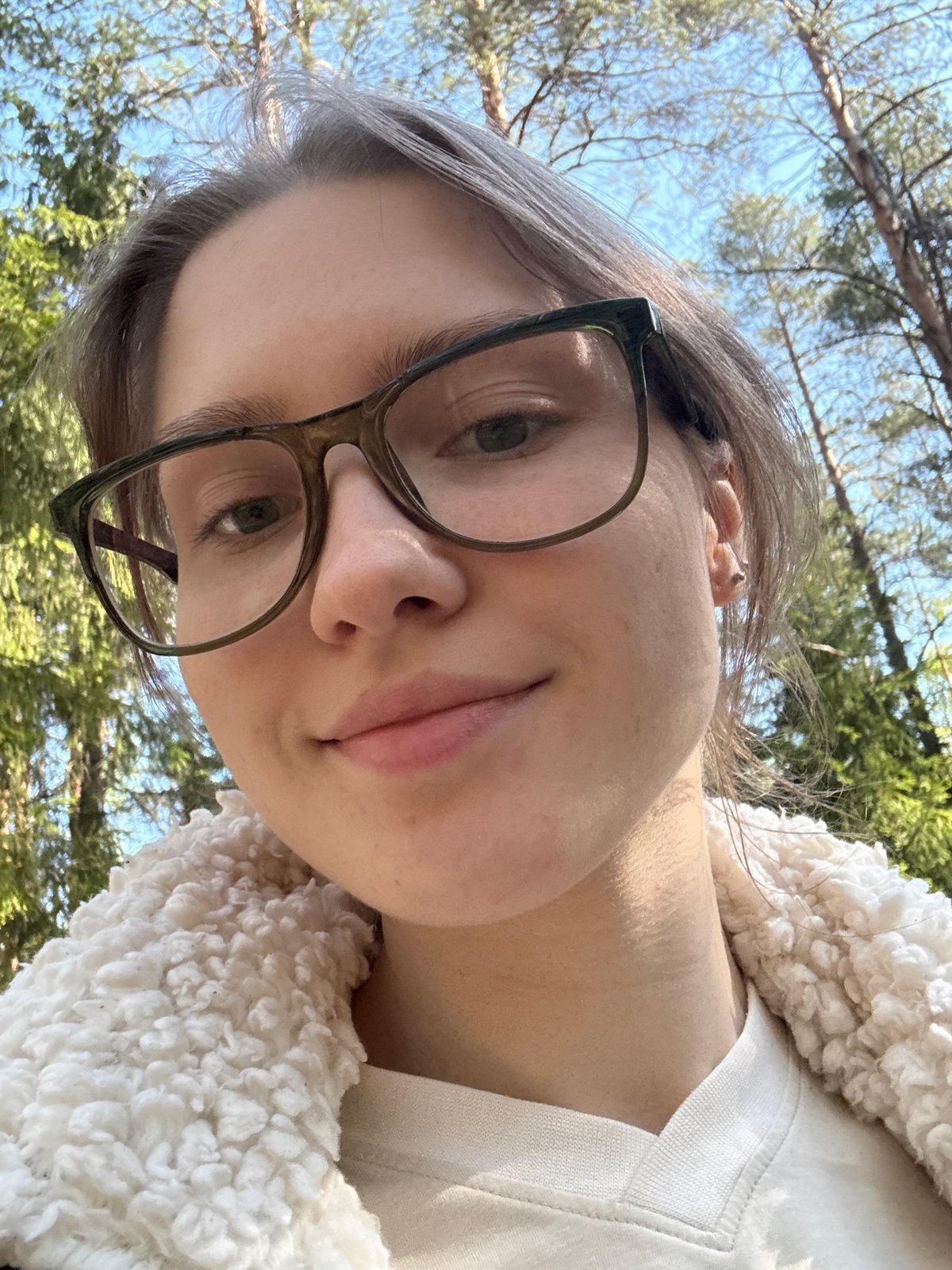 Gray-haired individual photographed looking upward in Solnechnoye, Russia