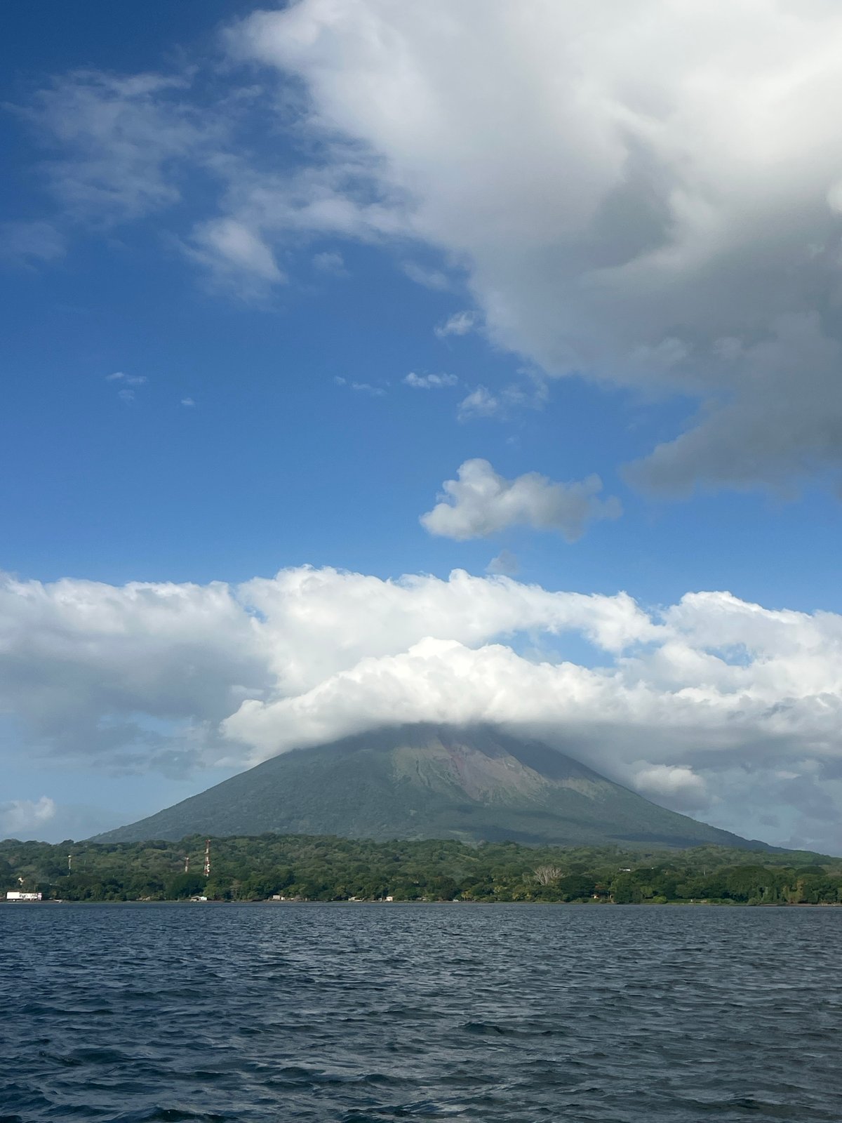 Cloud-draped volcano looms over Moyogalpa, Nicaragua