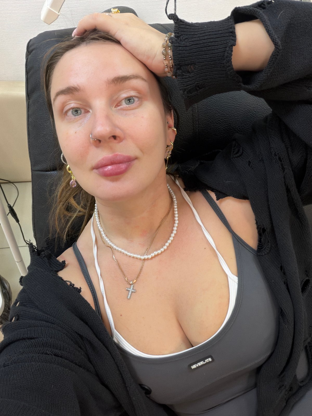Woman takes selfies in indoor spaces in Chaikovsky, Russia