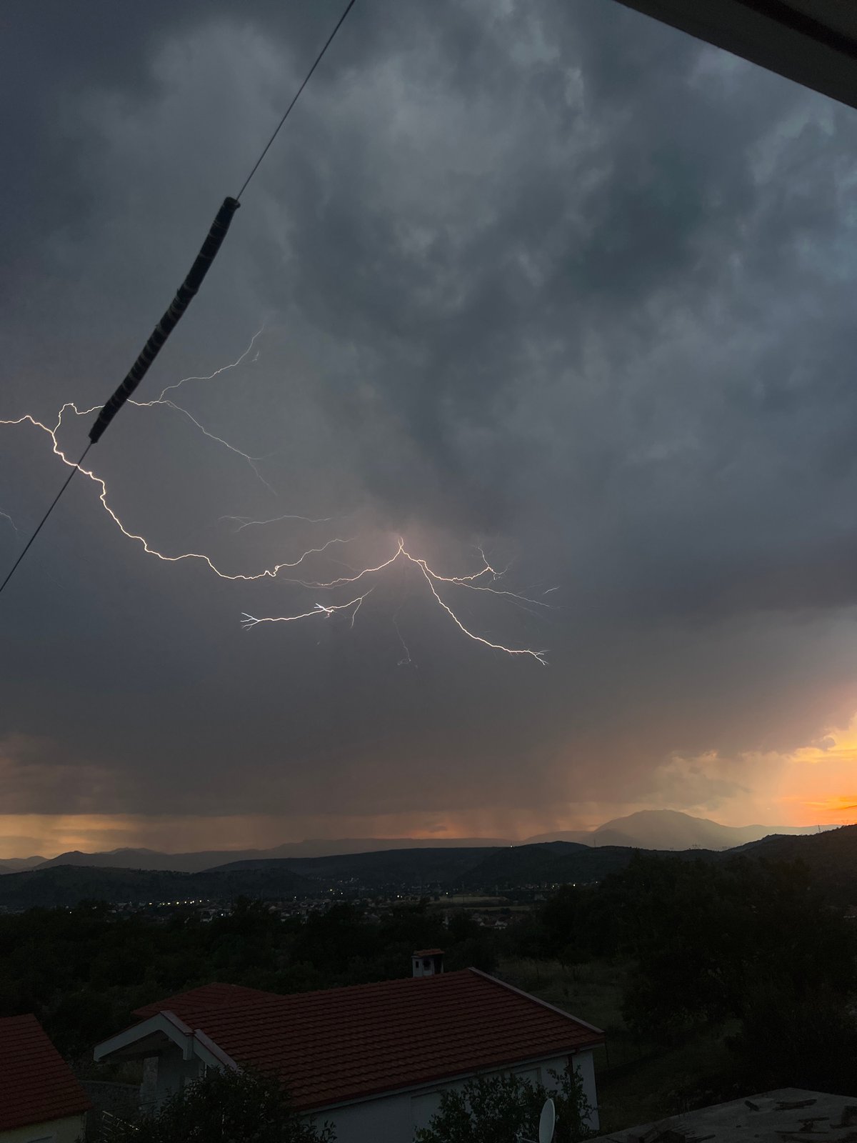 Stormy skies and quiet streets in Podgorica at dusk